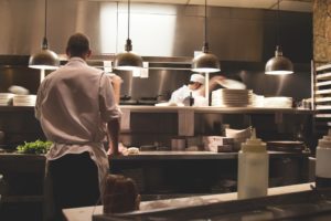 People working in a commercial kitchen 