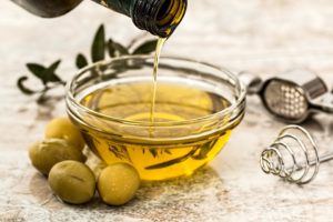 Cooking oil being poured into a bowl